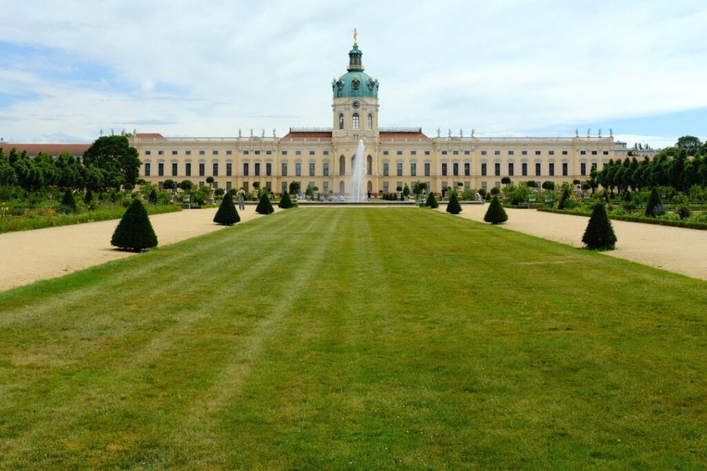 A large building with a lawn in front of it