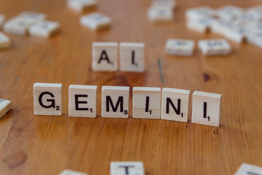 A wooden table topped with scrabble tiles that spell out the word all gen