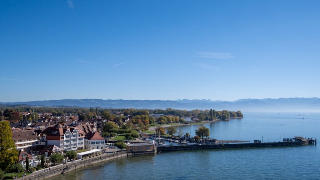 a body of water with buildings and trees around it