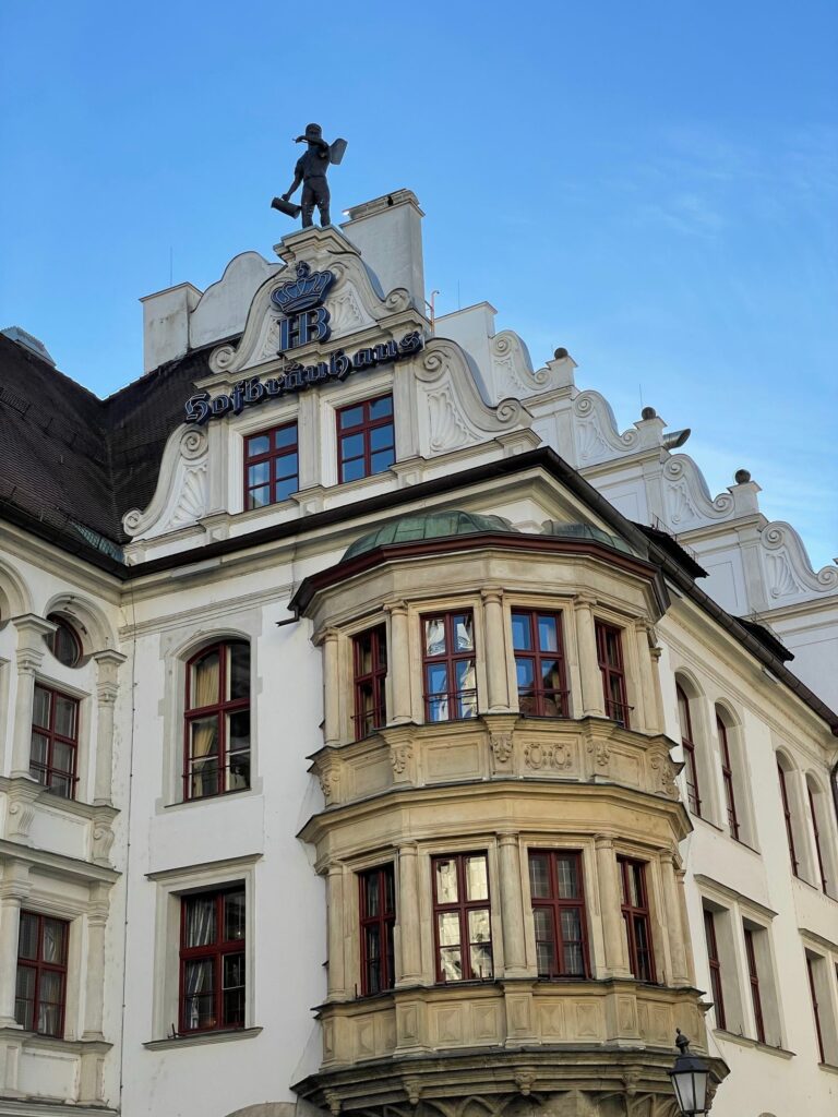 The Hofbräuhaus facade in Munich with its HB crown sign and corner oriel