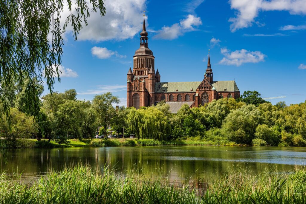 St Mary's Church (Marienkirche) in Stralsund, a massive red-brick Gothic church with a tall octagonal tower topped by a Baroque